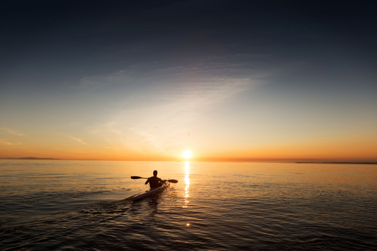 man-paddling-in-kayak-and-canoe-on-the-ocean-during-the-sunset-success quote